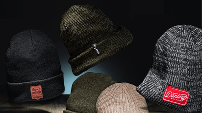 quality custom beanies with logo for business in bulk green beanie with woven tag, marled beanie with red embroidered patch and black cuffed beanie with leather patch made to order in usa