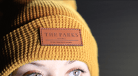 yellow custom knit beanie with leather patch engraved by dekni creations