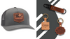 custom leather patch hats and custom leather keychains with your logo by dekni creations