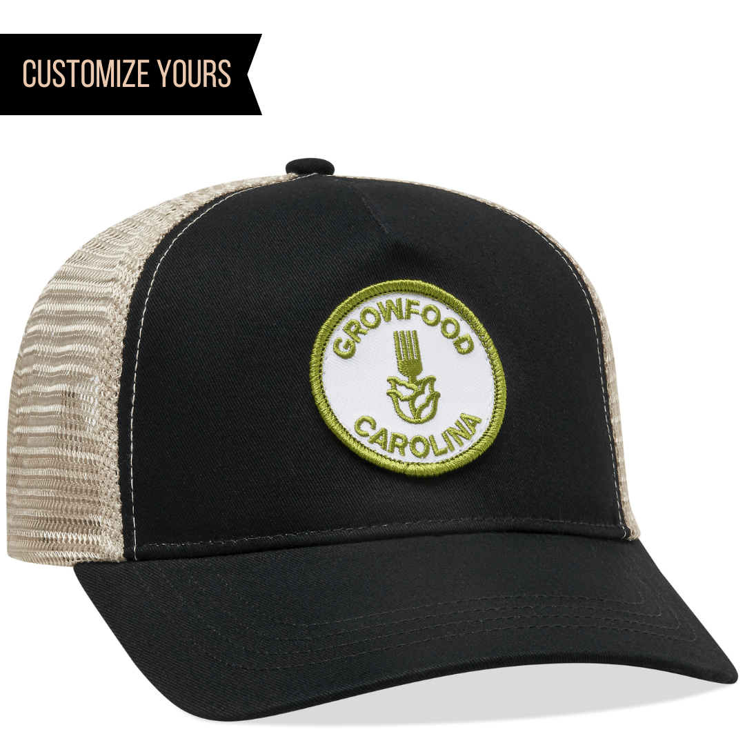 The Econscious EC7094 5-Panel Trucker Hat, combining organic cotton and recycled polyester, features a black and beige mesh design. A circular patch reads GROWFOOD CAROLINA with a green border and plant logo. For those seeking personalized options, CUSTOMIZE YOURS appears in the top left.