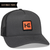 The Richardson 112FP – 5-Panel Snapback Trucker Hat features a dark gray front, black mesh back, and an orange square patch with a stylized black logo. A Customize Yours ribbon invites personalization, ideal for custom logo hats in bulk.