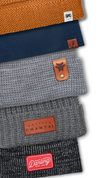 best company for custom winter knit beanie caps with custom logo as rivetted leather tag, woven label and embroidery in bulk for business