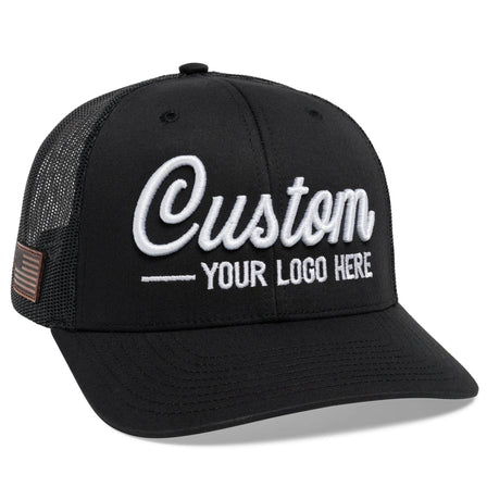 The C12-CTM Black Mesh Trucker Hat by BLVNK features bold white Custom cursive with YOUR LOGO HERE text on the front panel, offering a stylish way to showcase branded hats that reflect your style or logo.