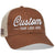 The Econscious EC7070 Sustainable Organic Cotton & Recycled Polyester Trucker Hat, available in brown and beige with a white embroidered Custom - Your Logo Here, features a mesh back and curved brim for stylishly showcasing your company logo.