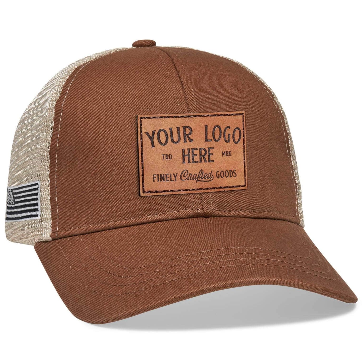 The Econscious EC7070 Sustainable Organic Cotton & Recycled Polyester Trucker Hat features a brown and beige design with a mesh back, ideal for custom logos. A rectangular leather patch on the front displays YOUR LOGO HERE and Finely Crafted Goods, with an American flag tag on the side.