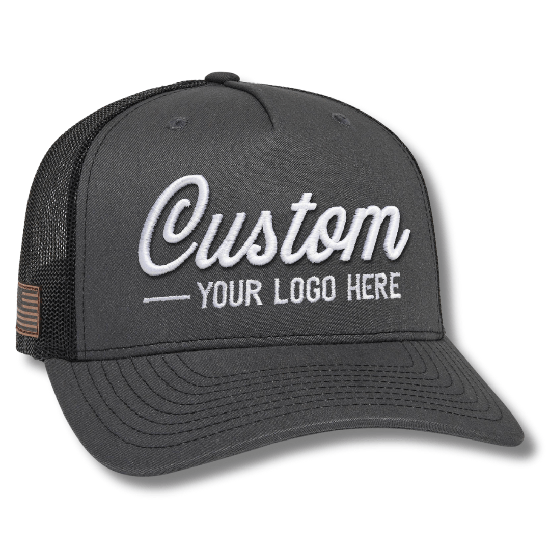 The Richardson 112FP 5-Panel Snapback Trucker Hat features a black front with Custom in white script and YOUR LOGO HERE stitched below, ideal for those seeking standout personalized hats with logos.