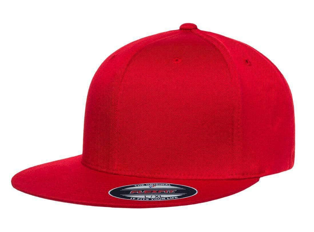 The Flexfit 6297F - Pro-Baseball Flat Bill Hat in red features a flat brim with a Flexfit brand sticker, perfect for those seeking to make a statement with custom hats.